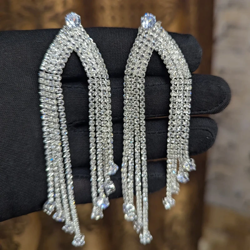 Silver Crystal Chandelier Tassel Earrings for Women 3 Silver crystal chandelier tassel earrings with open arch design and sparkling stones