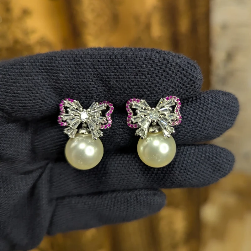 Silver Pearl Bow Earrings for Women 4 Pair of silver pearl bow earrings with sparkling stones and pink outline