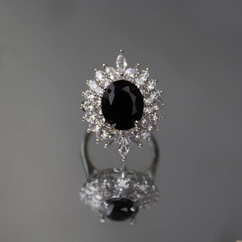 Silver-Tone Black Oval Crystal Statement Ring for Women 2 Front view of silver-tone ring with large black oval centre stone and clear crystals