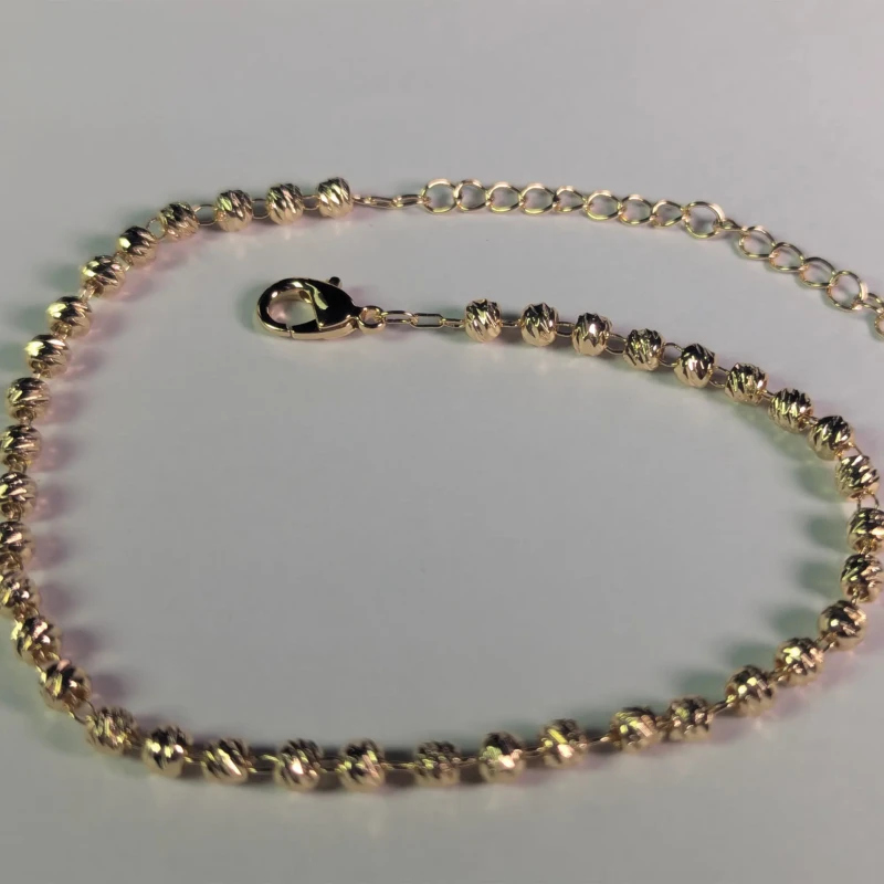 Gold-Tone Textured Beaded Anklet for Women 3 Close-up of gold-tone beaded anklet with lobster clasp and extension chain