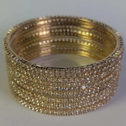 Full view of gold-tone crystal bangle set for women
