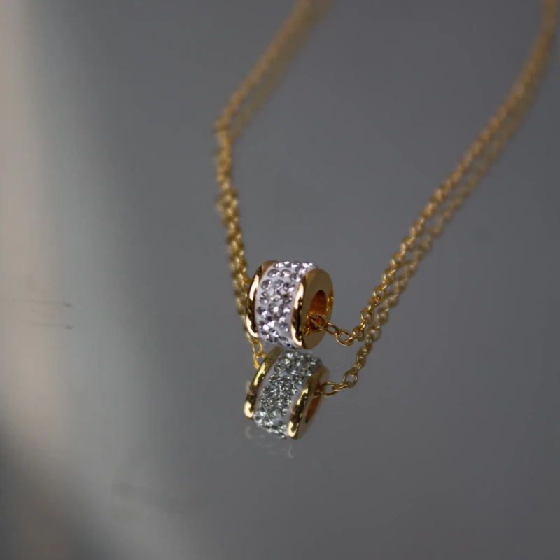 Gold-Tone Crystal Barrel Pendant Necklace for Women 3 Front view of gold-tone crystal barrel pendant necklace for women