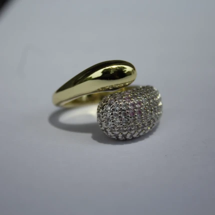Close-up of sparkling crystals on gold-tone wrap ring for women