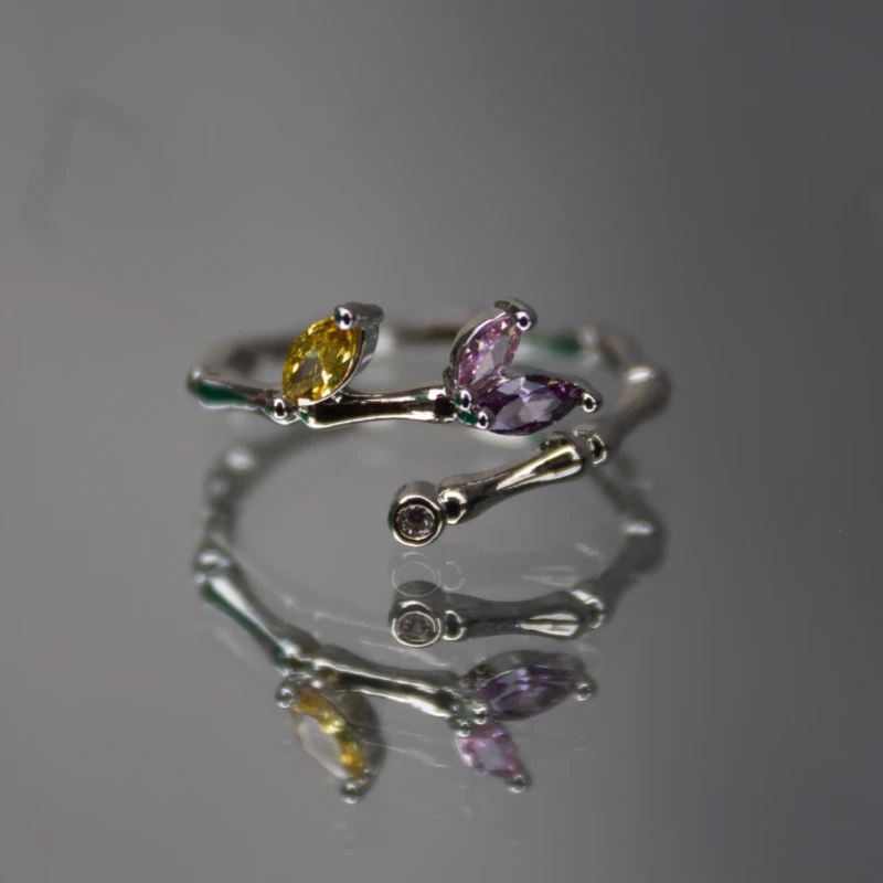 Silver-Tone Multicolor Crystal Leaf Wrap Ring for Women 2 Front view of women’s silver-tone leaf ring with purple and yellow stones