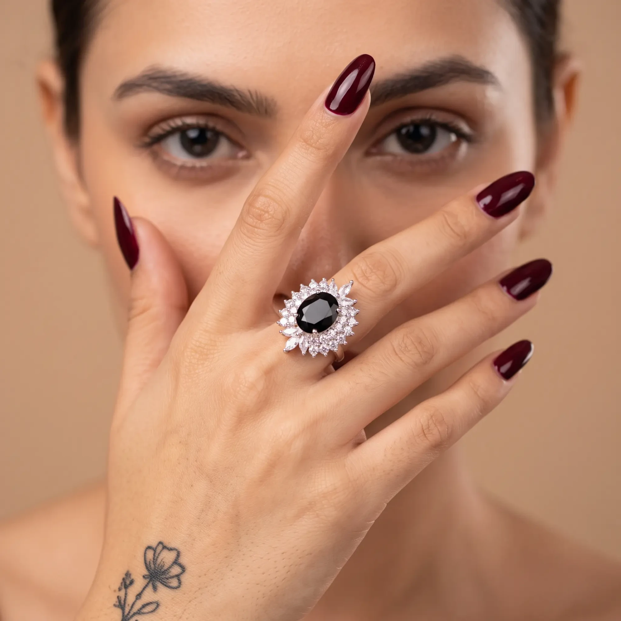 Silver-Tone Black Oval Crystal Statement Ring for Women Woman wearing a silver-tone statement ring with black oval stone and clear crystal halo