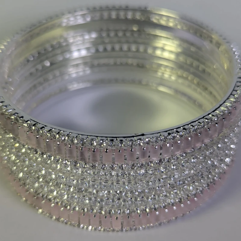 Silver-Tone Pink Crystal Bridal Bangle Set for Women 2 Close-up of sparkling clear and pink crystals on bridal bangles