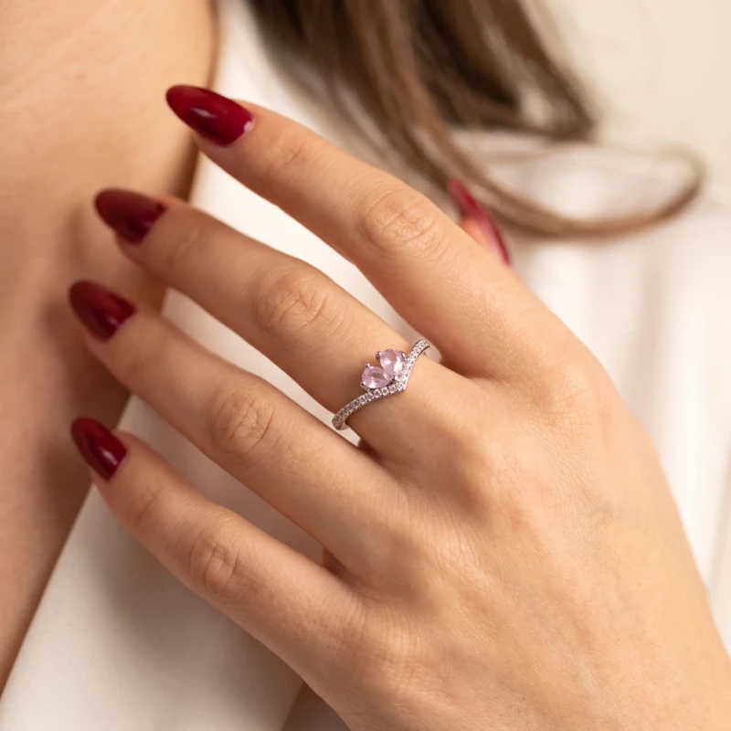 Silver-Tone Pink Crystal Butterfly Ring for Women 1 Woman wearing a silver-tone butterfly ring with two pink pear-shaped crystals