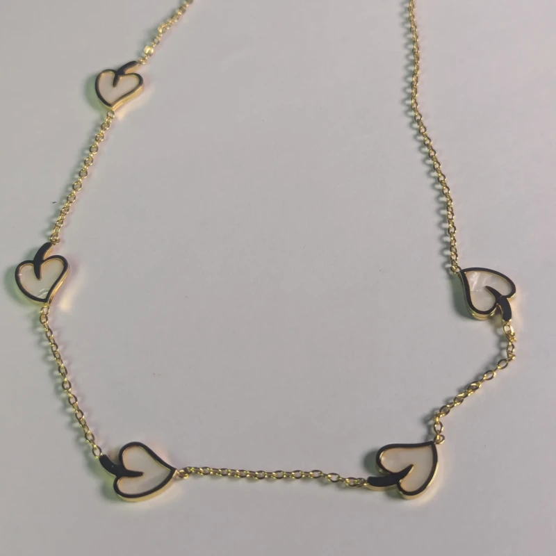 Gold-Tone White Heart Charm Necklace for Women 3 Detailed view of women’s gold-tone necklace with multiple white hearts